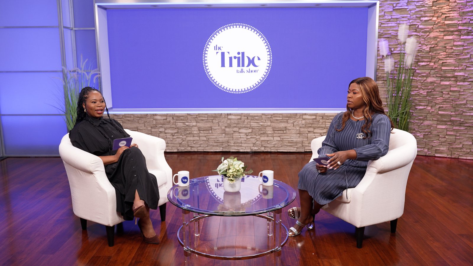 Two hosts recording a branded video podcast in an Atlanta studio