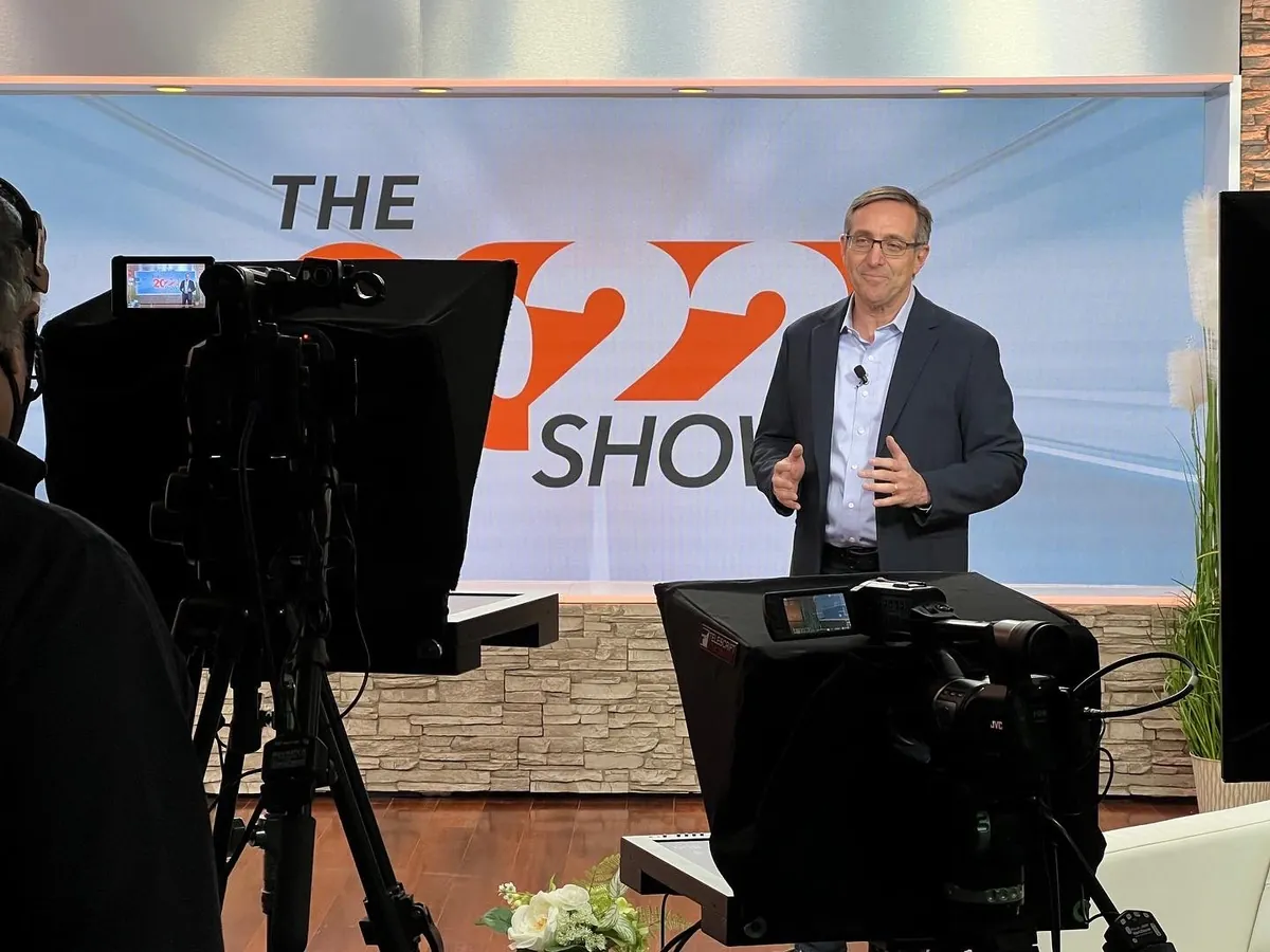 Executive presenting on camera during a studio video production