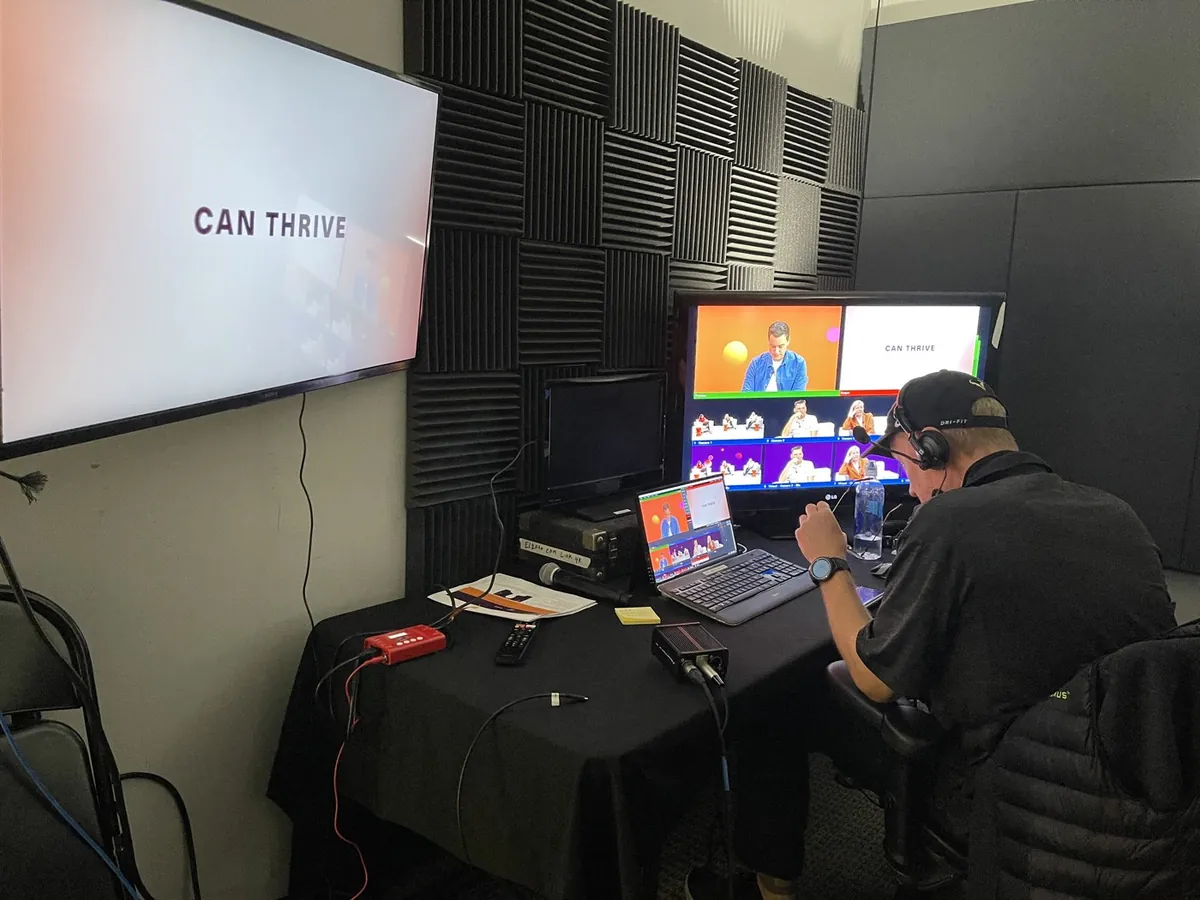 Production operator monitoring a multi-camera webcast at a client location